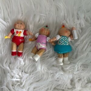 Set of Three Vintage Dolls in Red, Pink, and Blue Outfits